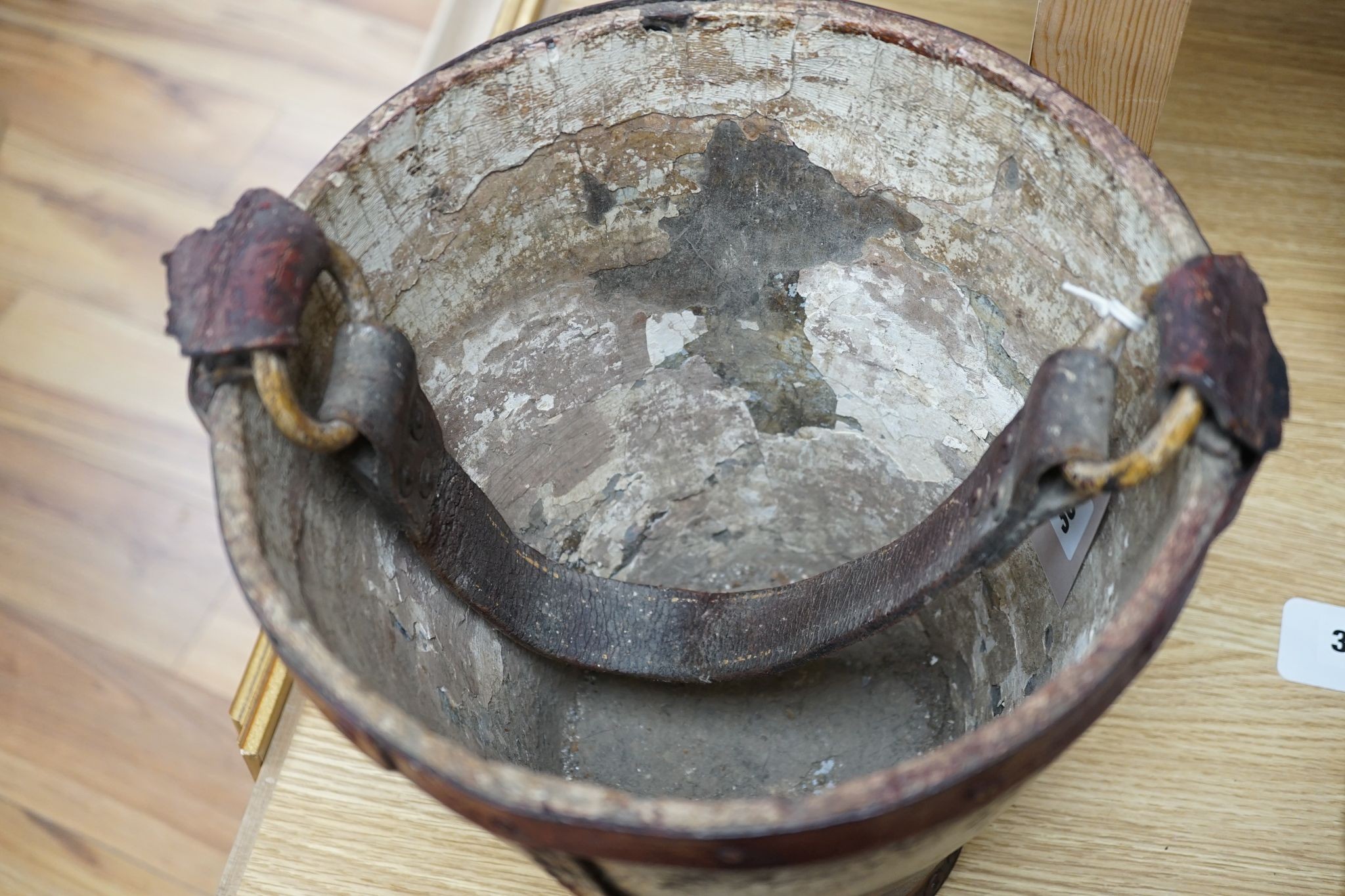 A painted leather fire bucket, later decorated ‘Government House Gibralter’ 27cm